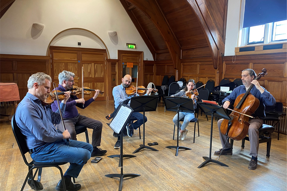 Five string players rehearsing at the Royal College of Music 